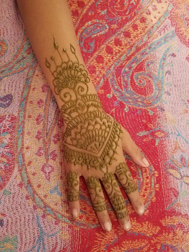 Floral henna design applied by a Henna Haven artist